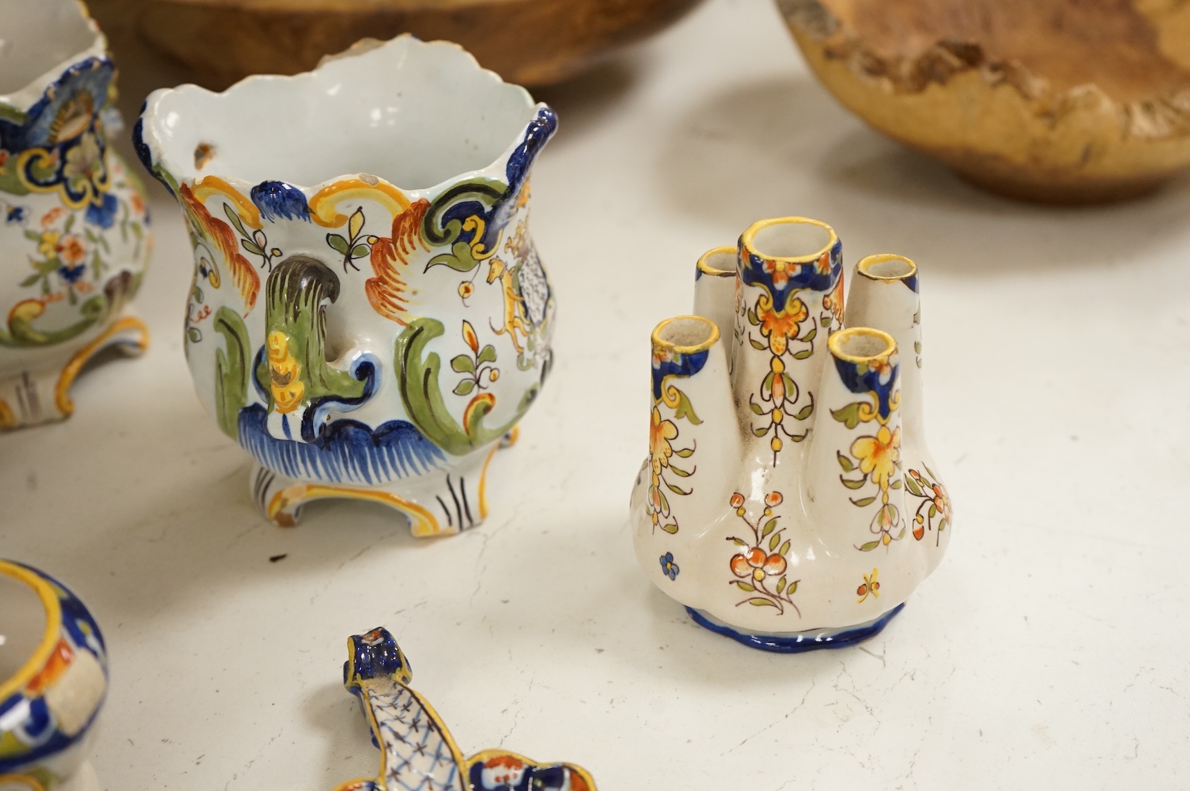 A collection of early 20th century French faience pieces, tallest 37cm